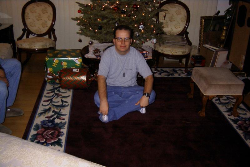 Jaimal, 19, in front of the Christmas Tree.  Greg's knees on left.